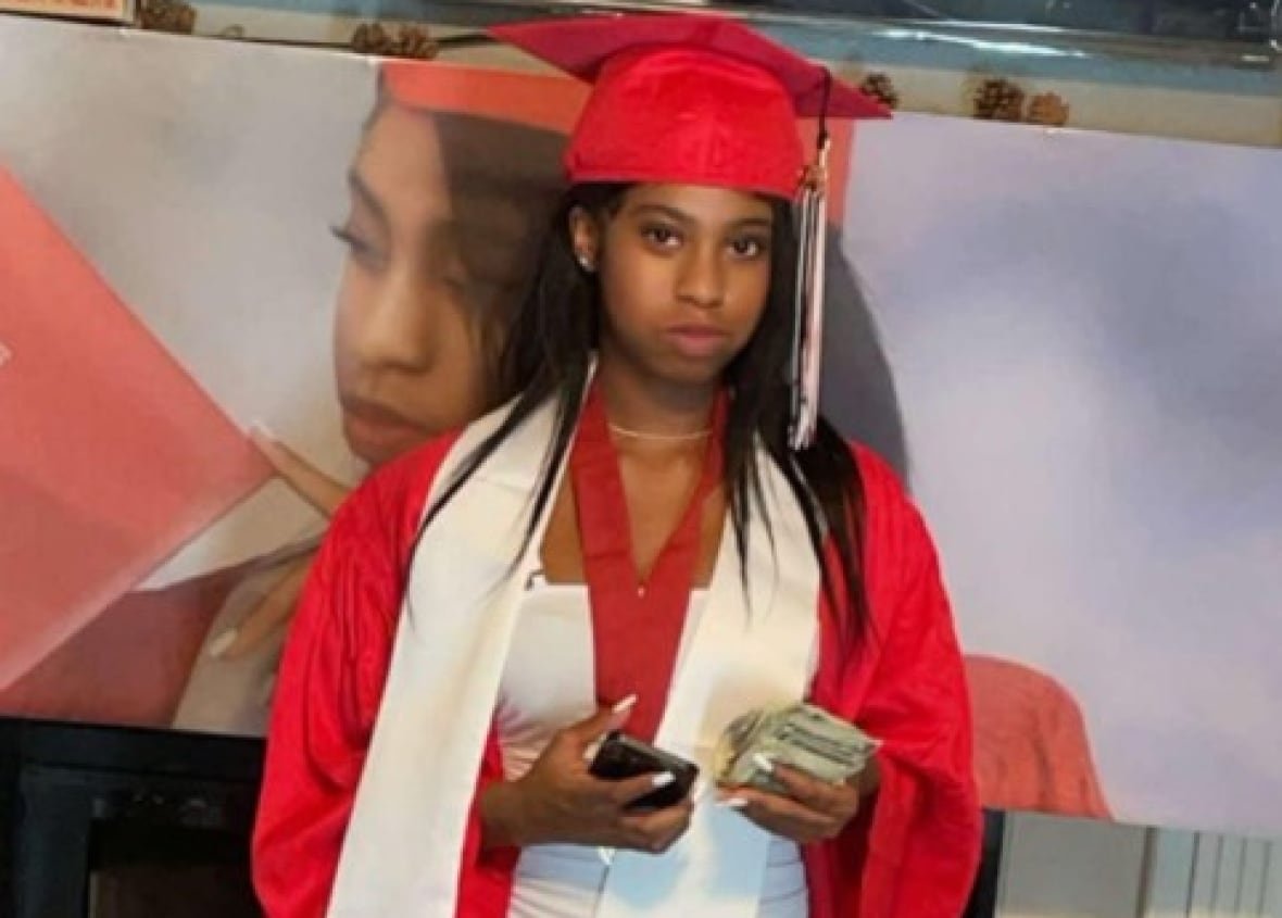 A woman attends her graduation.