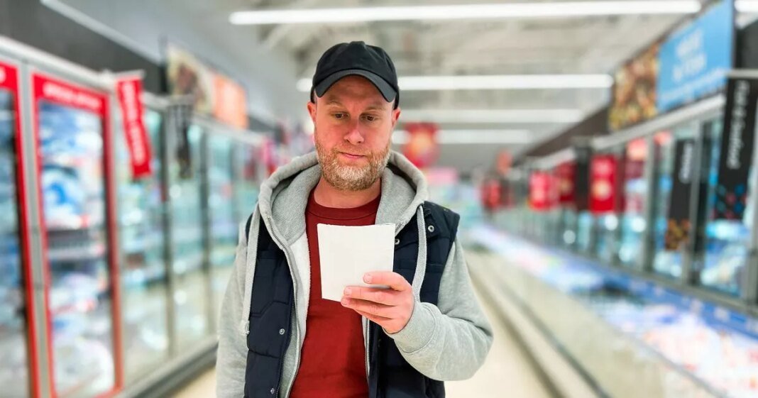 0_mid-adult-man-looking-at-list-while-shopping-in-supermarket