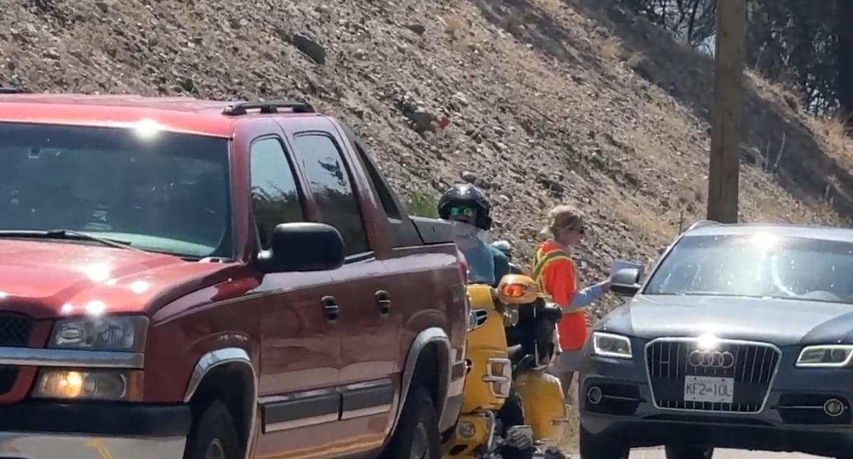 Residents return near the Quilpituk Creek fire as part of a staged process to manage traffic.